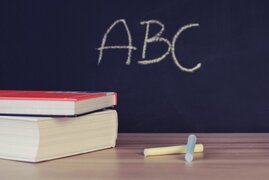 books-chalk-and-blackboard-in-classroom.jpg